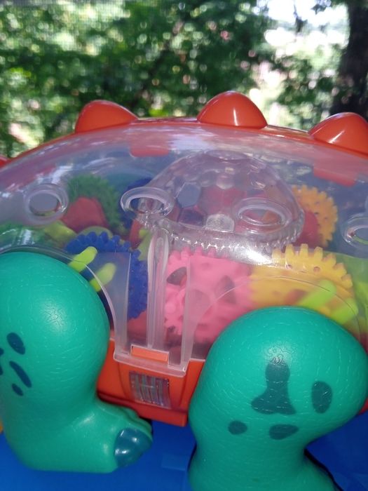 Динозавр,танцює,шестерні звук,світло 2 кольори