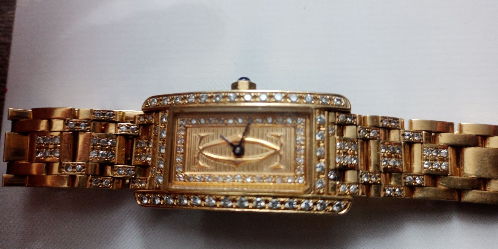 Złoty zegarek, cartier z brylantami, pr.750