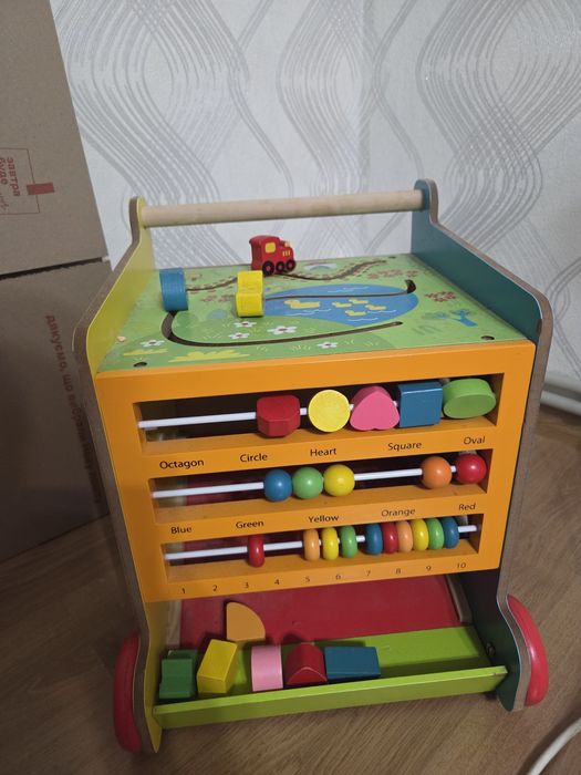 Бізі-куб, каталка для дітей Розвиваючий куб EcoToy