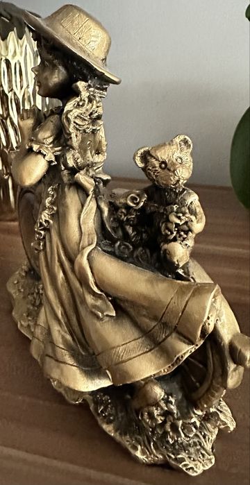 Zegar kominkowy zloty dziewczynka na rowerze