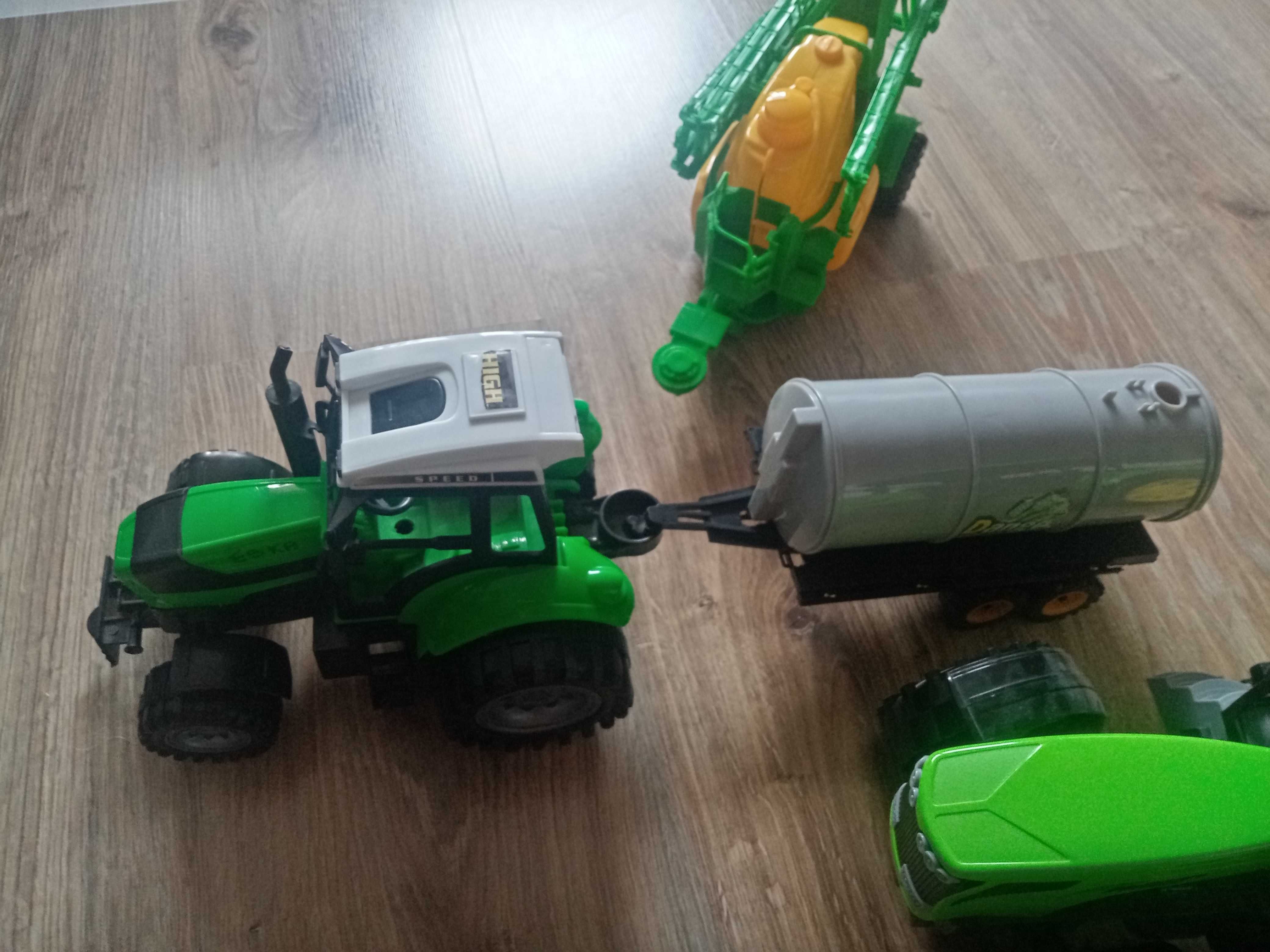 Traktory z beczka i opryskiem i brona
