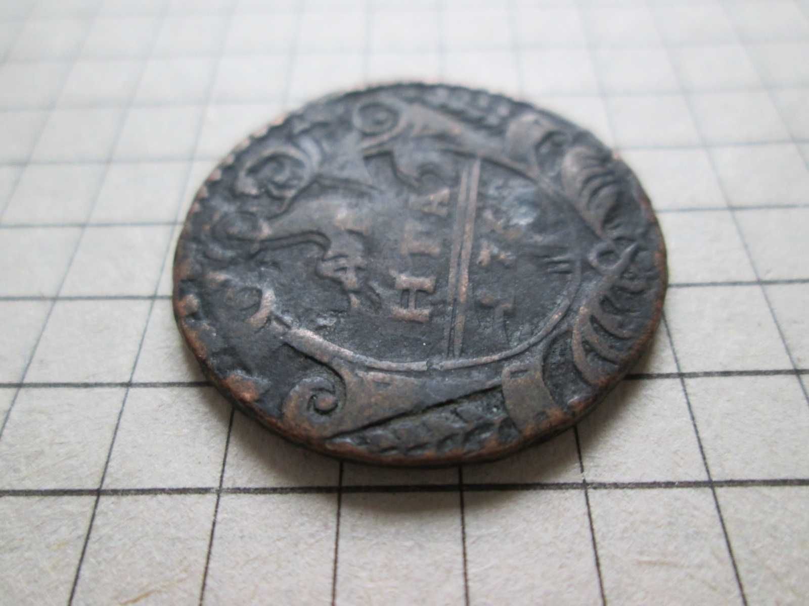 Монета Денга перечекан с поворотом