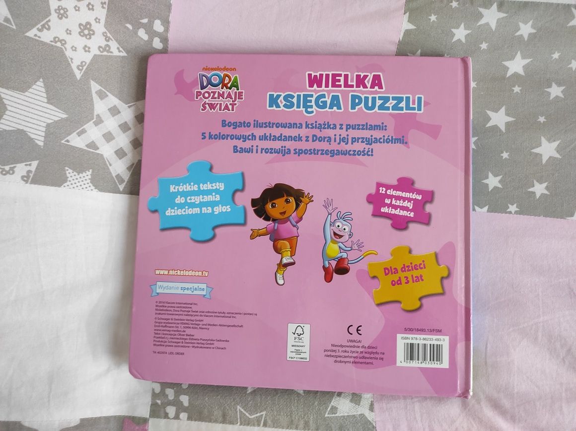 Dora poznaje Świat książka z puzlami