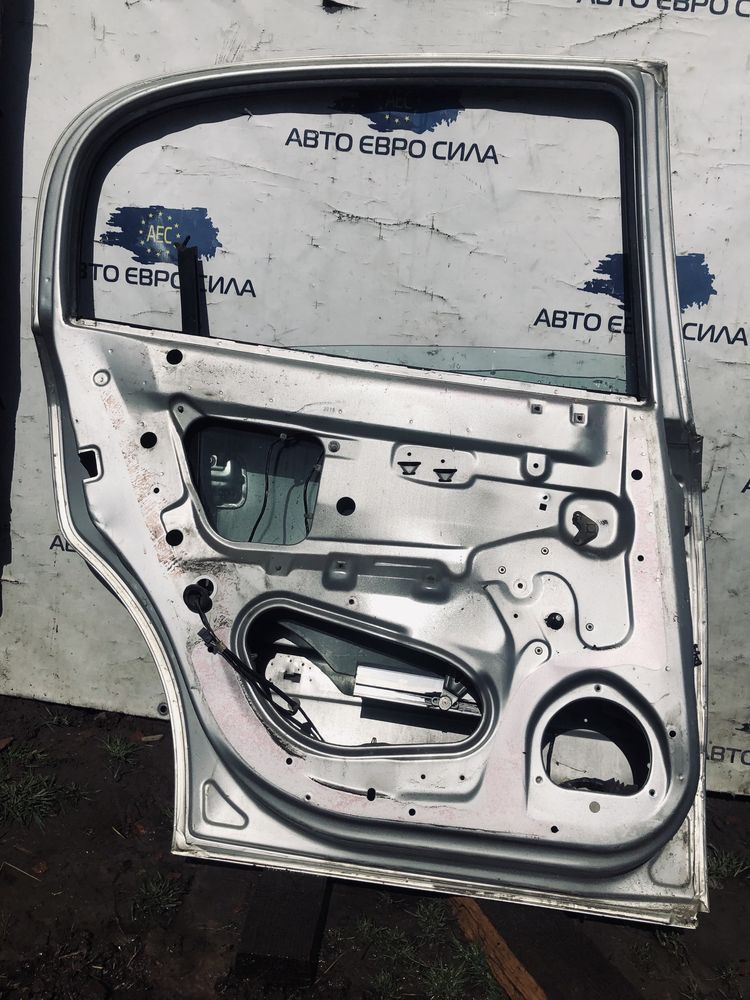 Двері задні ліві Opel astra G.седан.