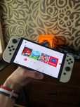 Nintendo Switch OLED + Mario Kart i dużo akcesoriów GRIP NitroDeck