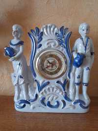 Porcelanowy zegar kominkowy  25/25 cm.