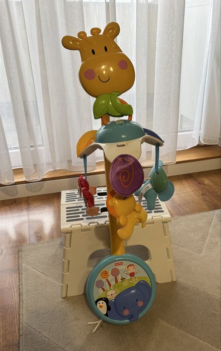 Przenośna karuzela Fisher-Price z pozytywką żyrafa
