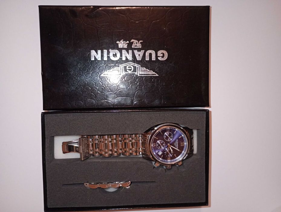 Годинник новий Guanqin