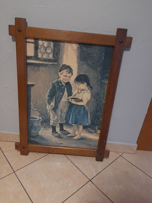 Sprzedam obraz w drewnianej ramię.