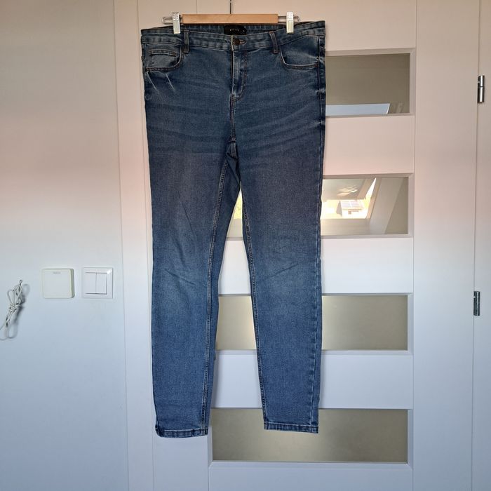 Jeansy damskie Mohito 42