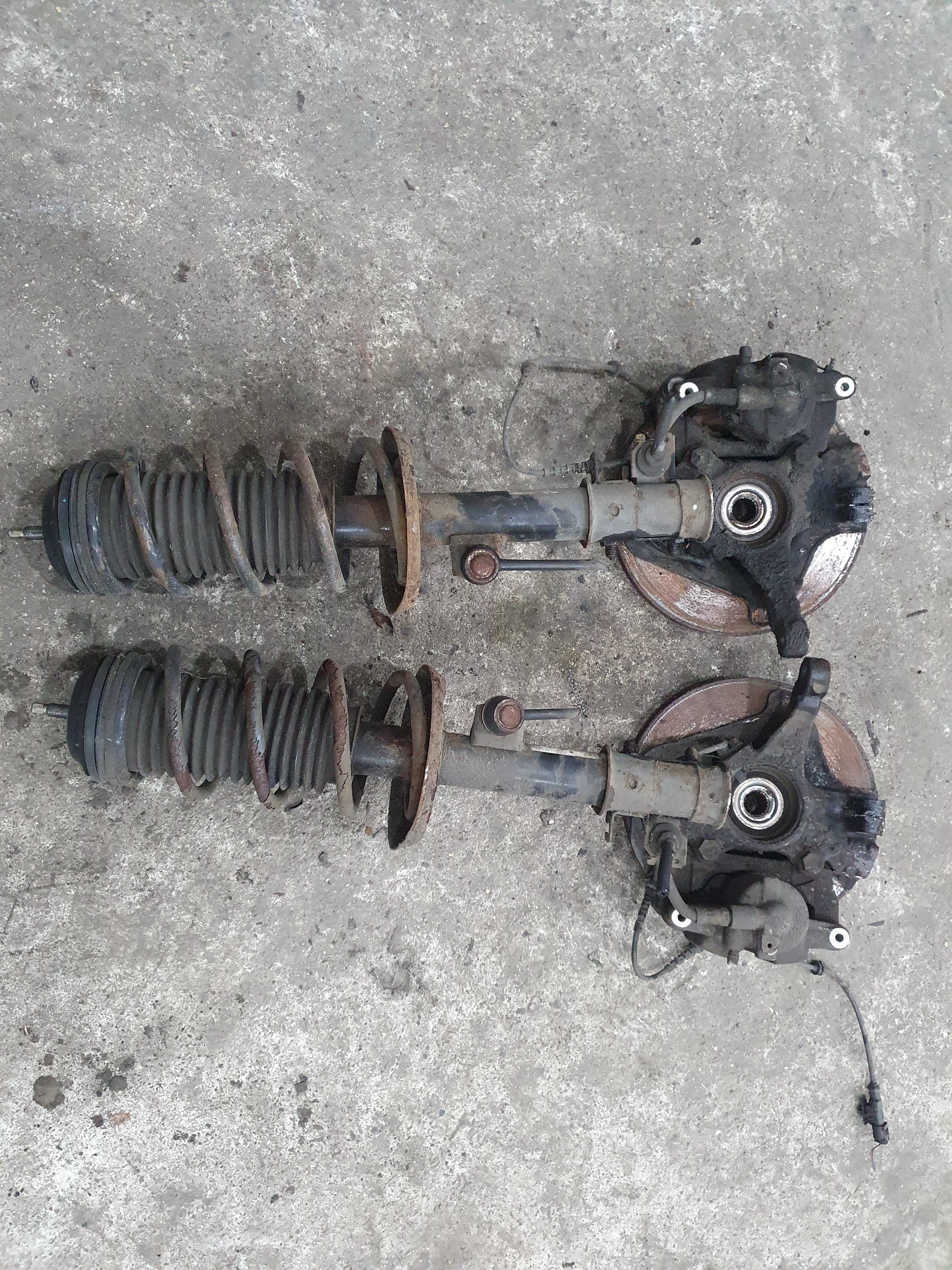 Amortyzator piasta zwrotnica zacisk sprezyna Opel Corsa D 1.2