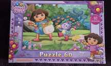 Puzzle dora poznaje świat