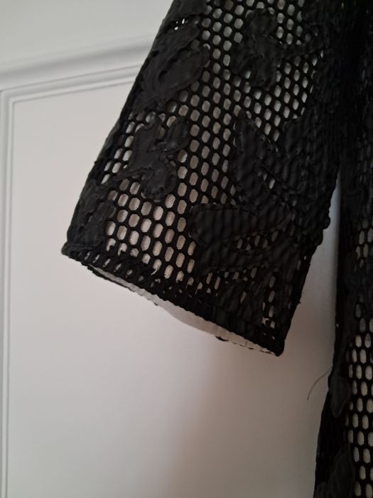 Casaco preto arrendado