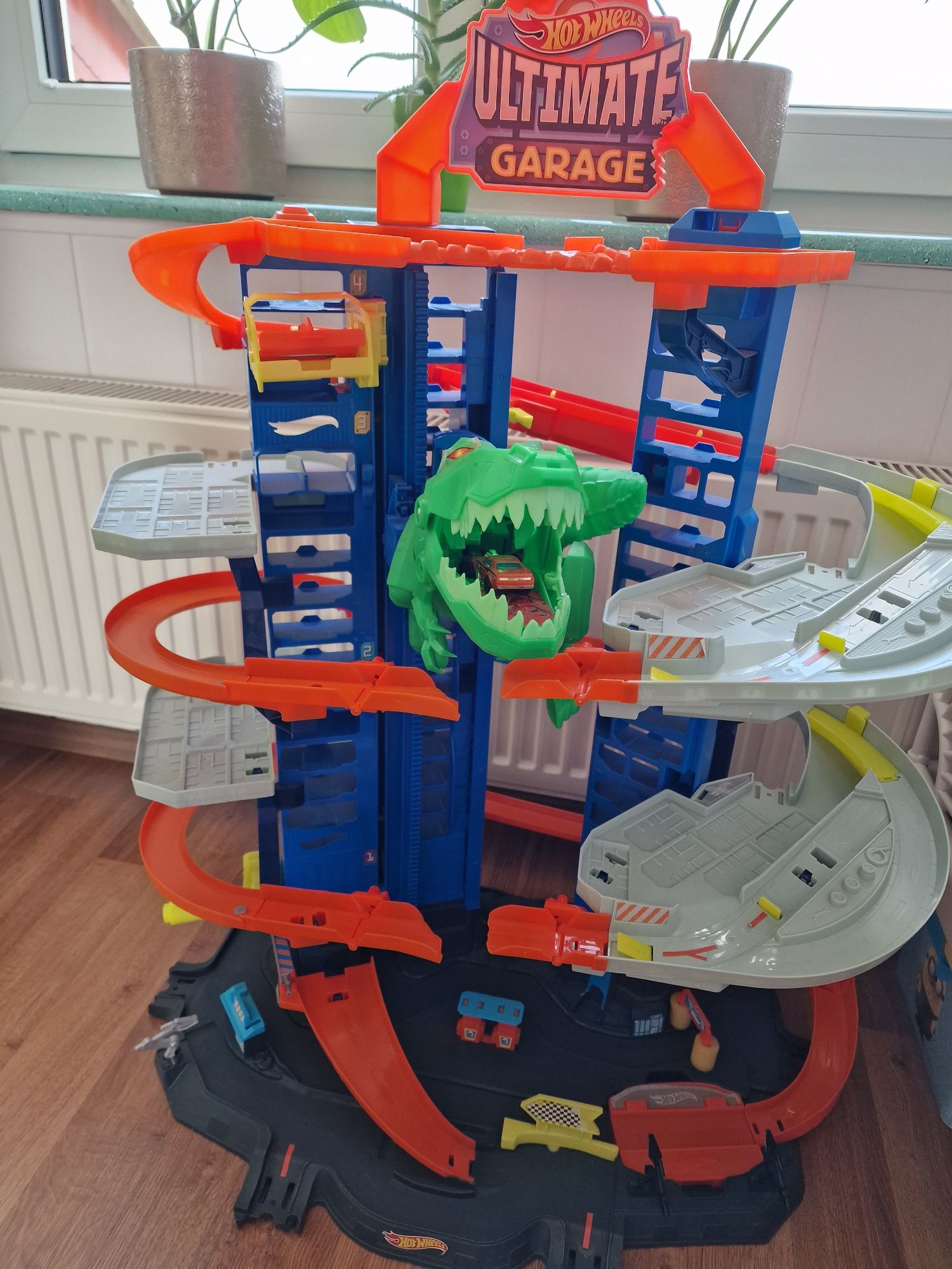 Garaż dla aut Hot Wheels City Mega Garaż T-Rexa GJL14