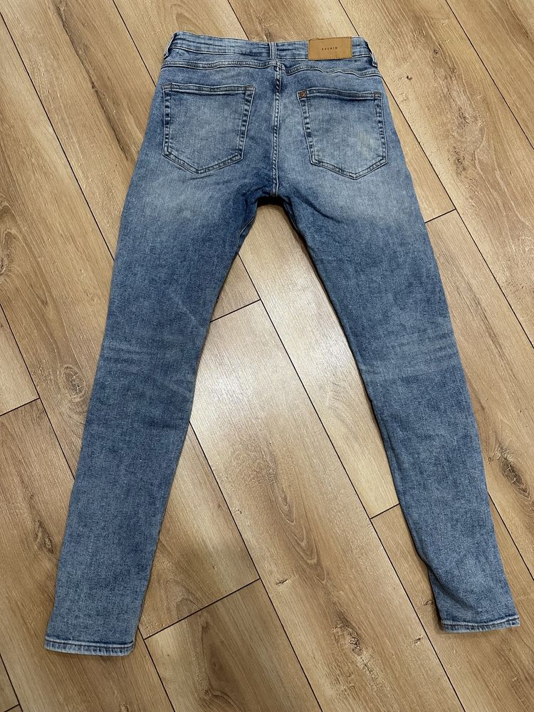 Spodnie jeansy skinny męskie z dziurami 31