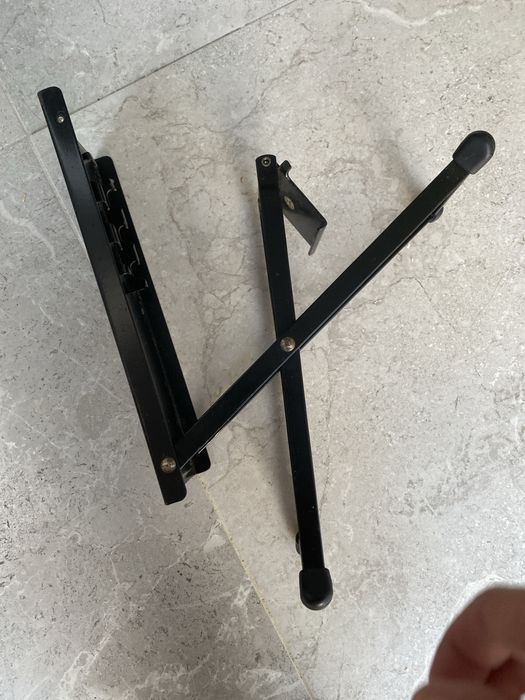 Pé de apoio para guitarrista