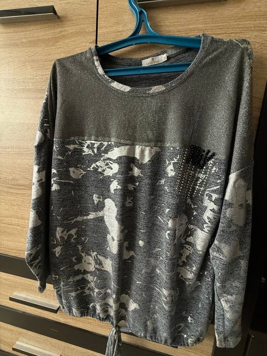 Одяг для жінки .