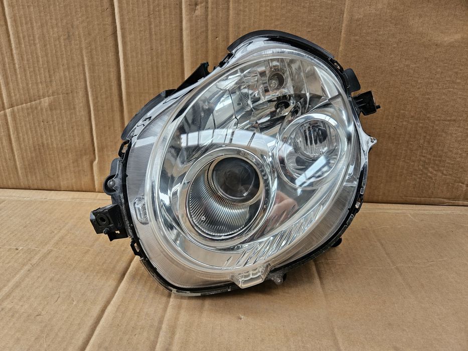 Lampa lewa przód przednia Daihatsu Copen 02-10