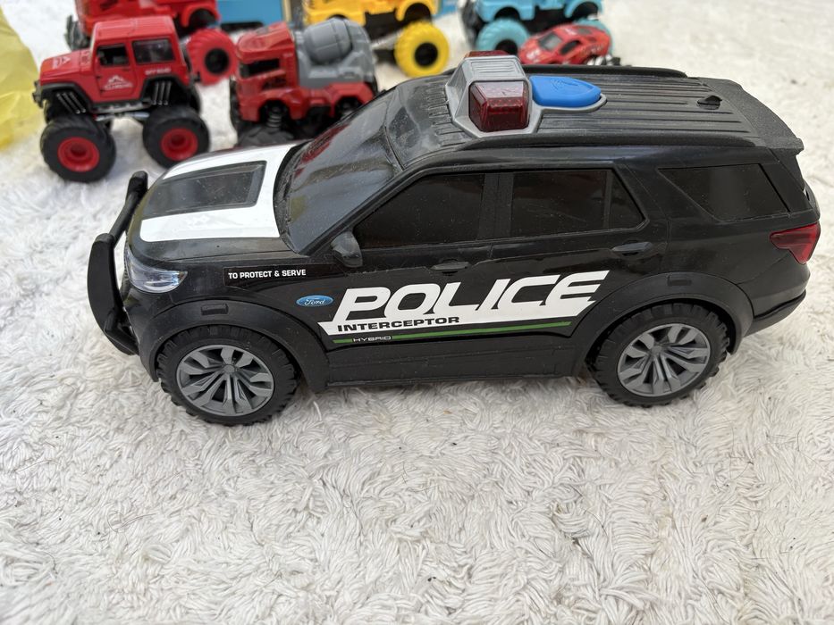 Машинки іграшкові, трамвай, поліцейська машина і тп