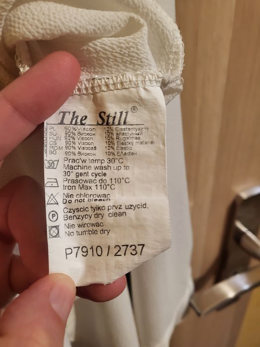 Biała koszula asymetryczna