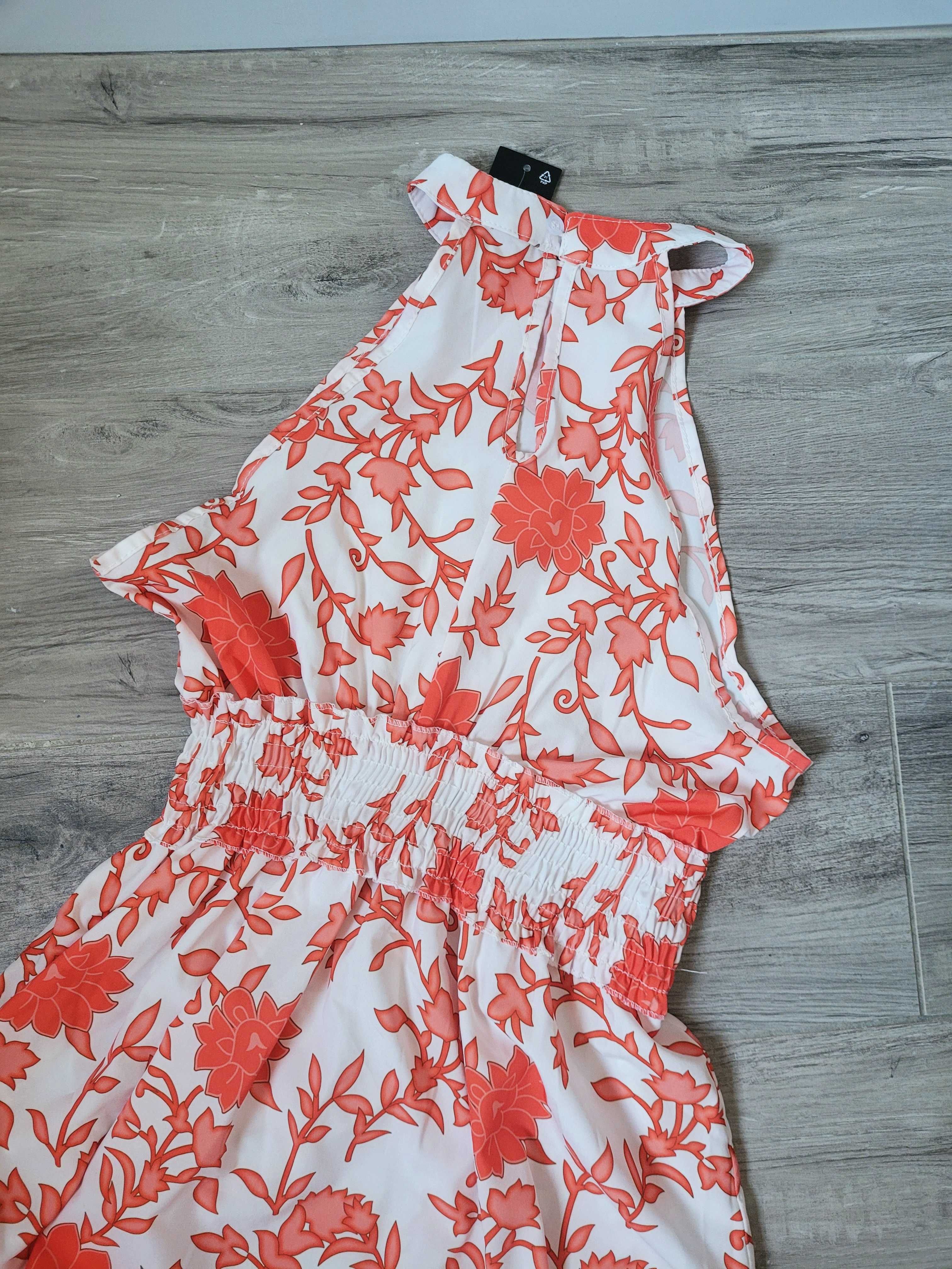 Zwiewna asymetryczna sukienka dekolt halter boho falbana