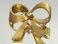 Złota broszka - kokarda, 14K. poł. XX w.