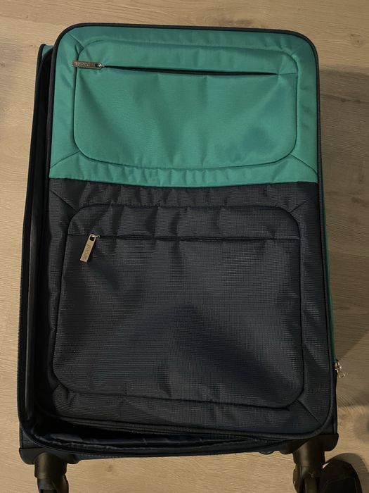 Mala de viagem de marca Pack it com a cor azul/verde a