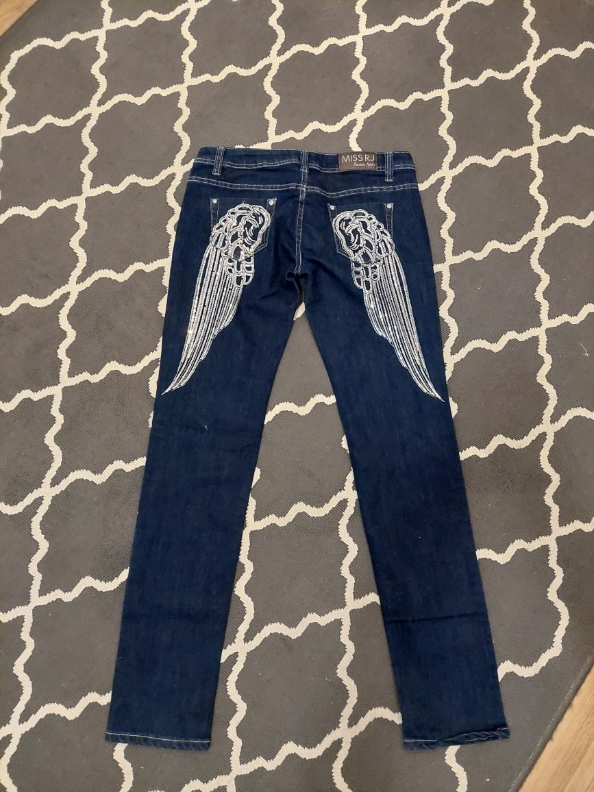 Spodnie jeans skrzydła 44