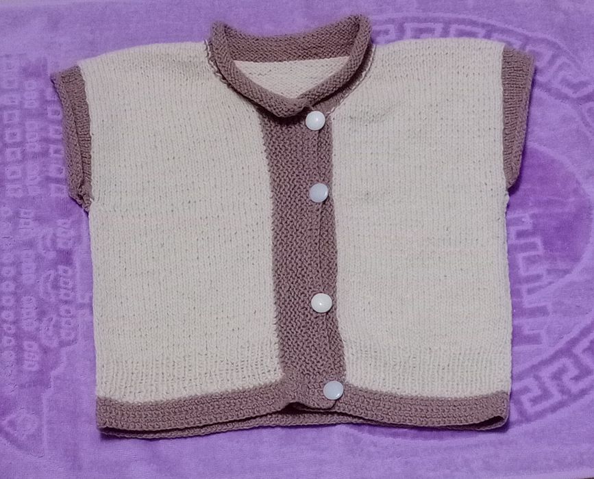 В'язана жилетка .