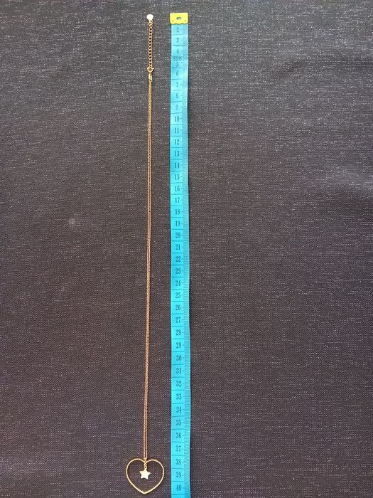 Naszyjnik dłuższy serce z gwiazdką.