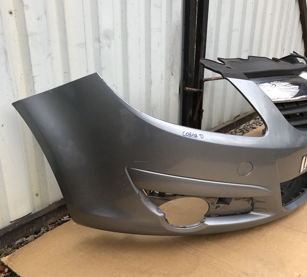Бампер передній з решіткою радіатора Opel Corsa D 06-10р.
