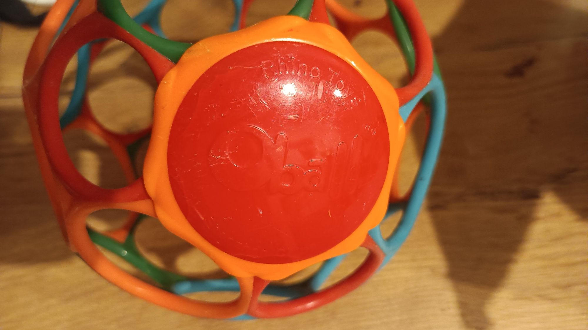 Piłka sensoryczna dla niemowląt Oball Rollin Rainstick Klepsydra 81030