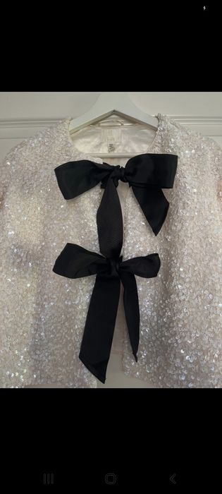 Stylowy kardigan z kokardami i cekinami H&M poszukiwany