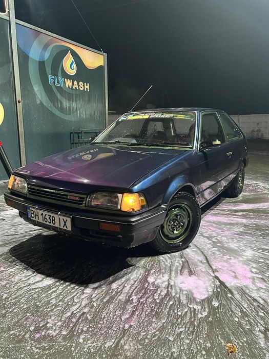 Mazda 323 familia автомат расход 7 литров