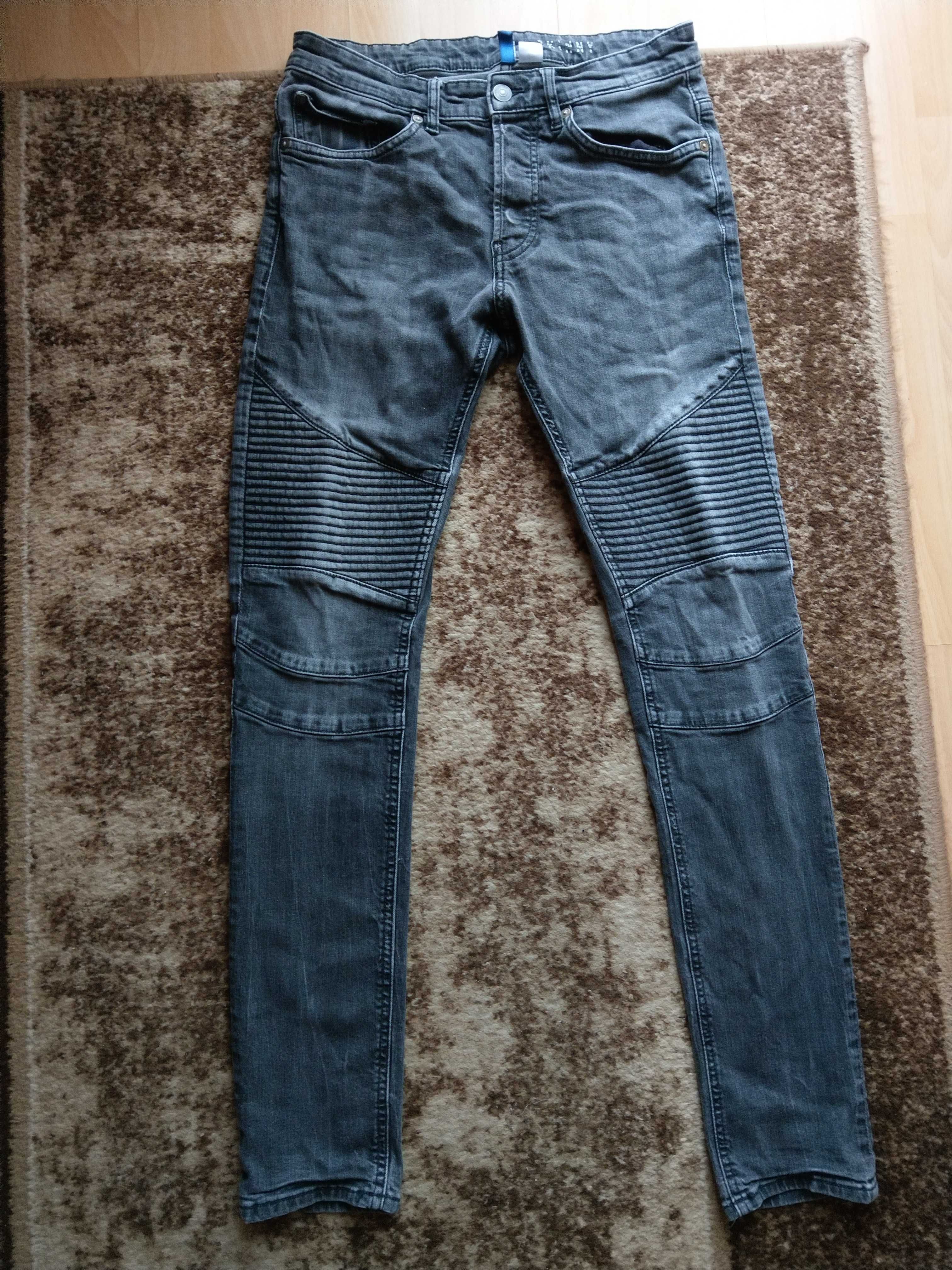 spodnie jeansowe z przetarciami i przeszyciami Divided H&M skinny fit