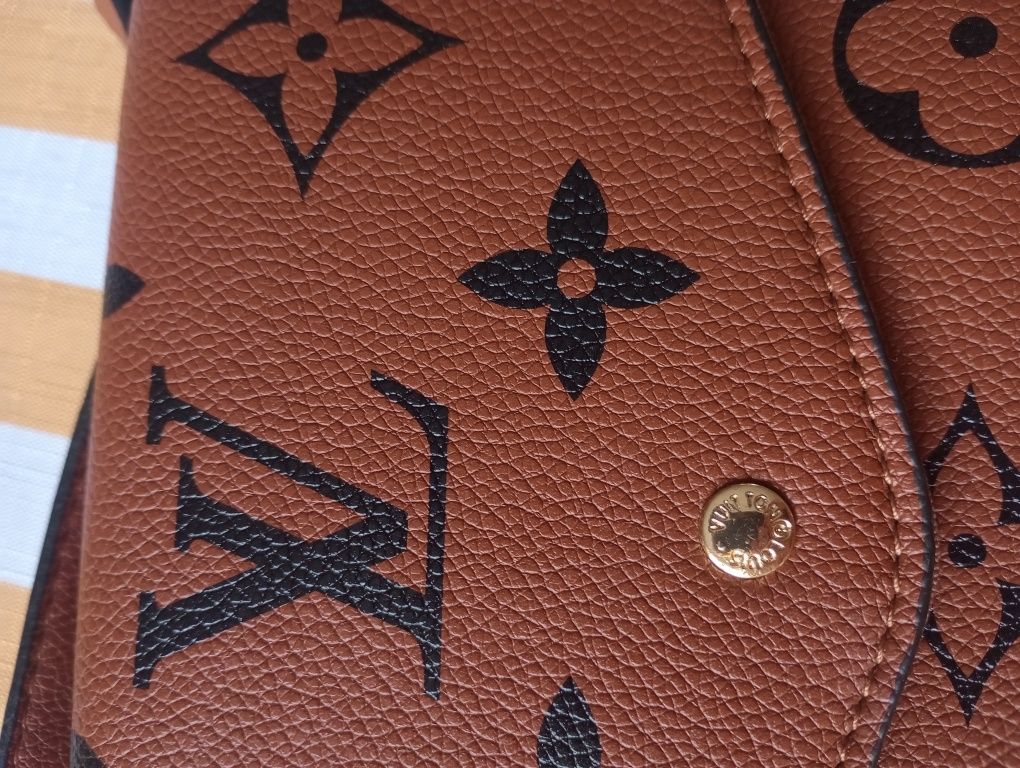 Skórzana kopertówka oryginalna Louis Vuitton