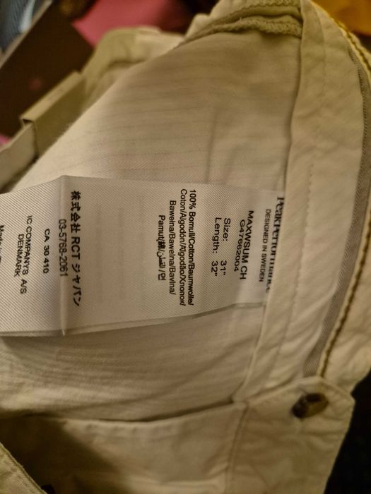 Spodnie chinos Peak Performance 31 / 32 białe nowe