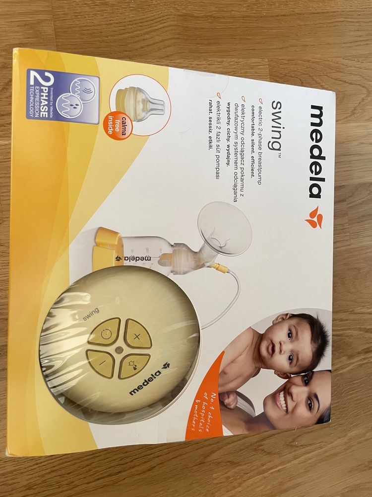 Laktator Medela Swing + 10 butelek