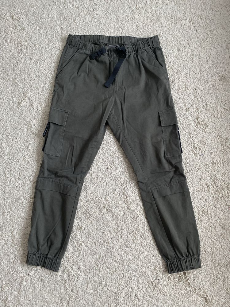 Zielone khaki spodnie cargo bojówki wojskowe z kieszeniami asos 38 M