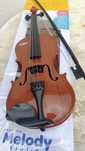 Violino de plástico para criança
