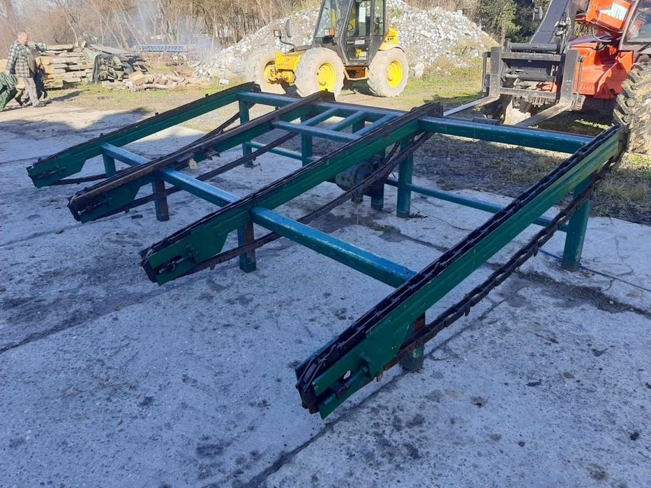 Podajnik poprzeczny do pryzmy / deski / (trak obrzynarka wielopiła)