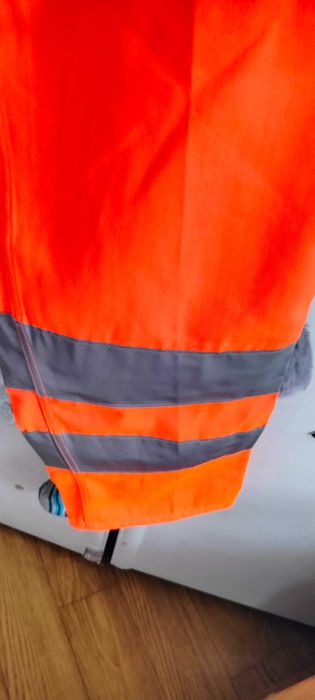 Nowe spodnie robocze ochronne ostrzegawcze pomarańczowe Planam