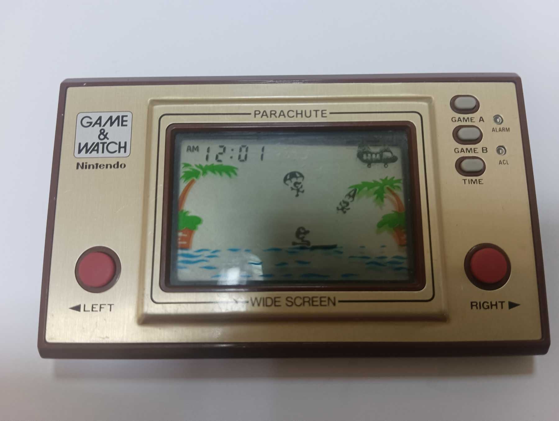 Ігрова та годинникова консоль Nintendo game & watch parachute 1981