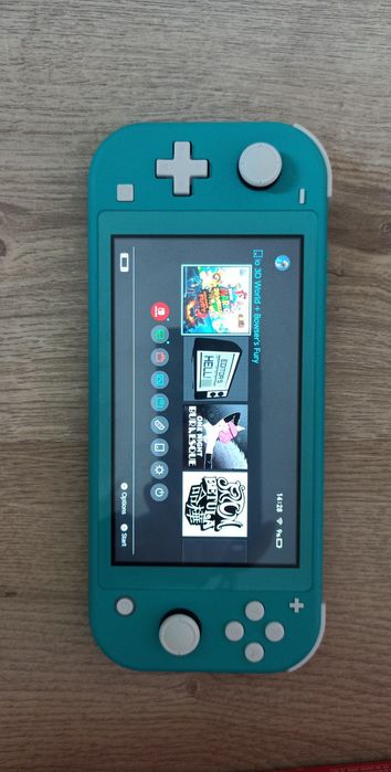 nintendo switch lite turkusowy 32gb + case + pudełko + ładowarka + gry