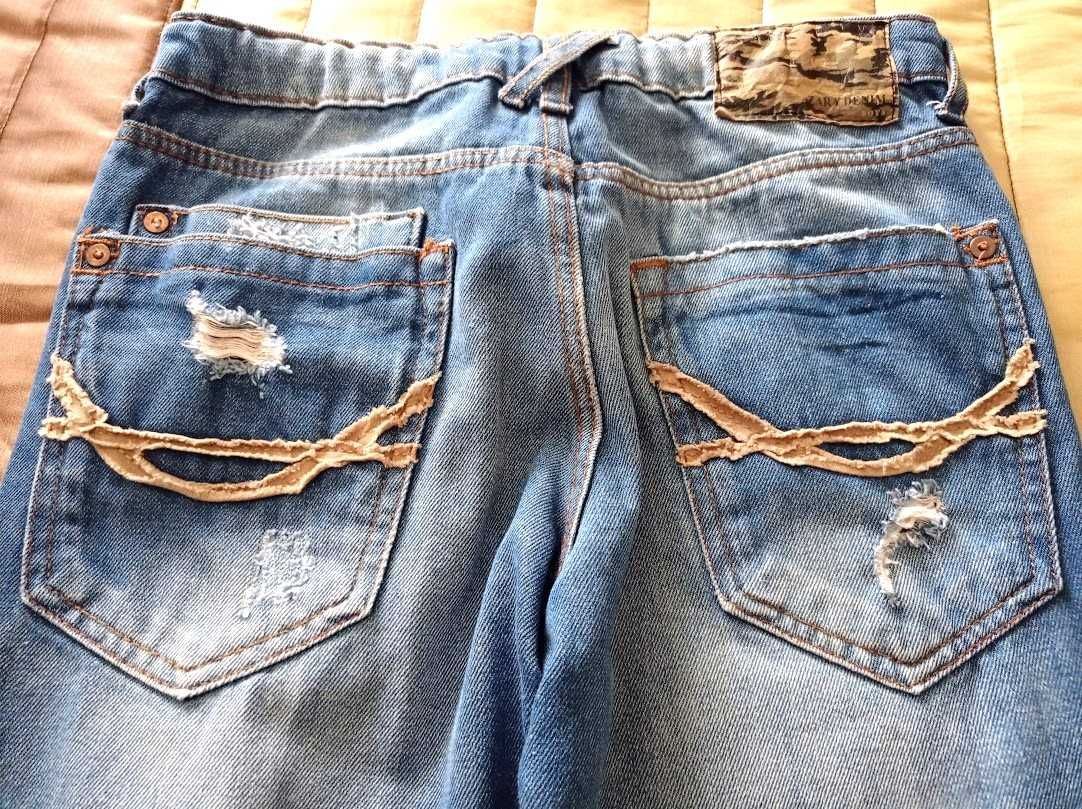 Jeans ganga. efeito deslavado e rasgões para rapaz Tam. 9/10 - Zara