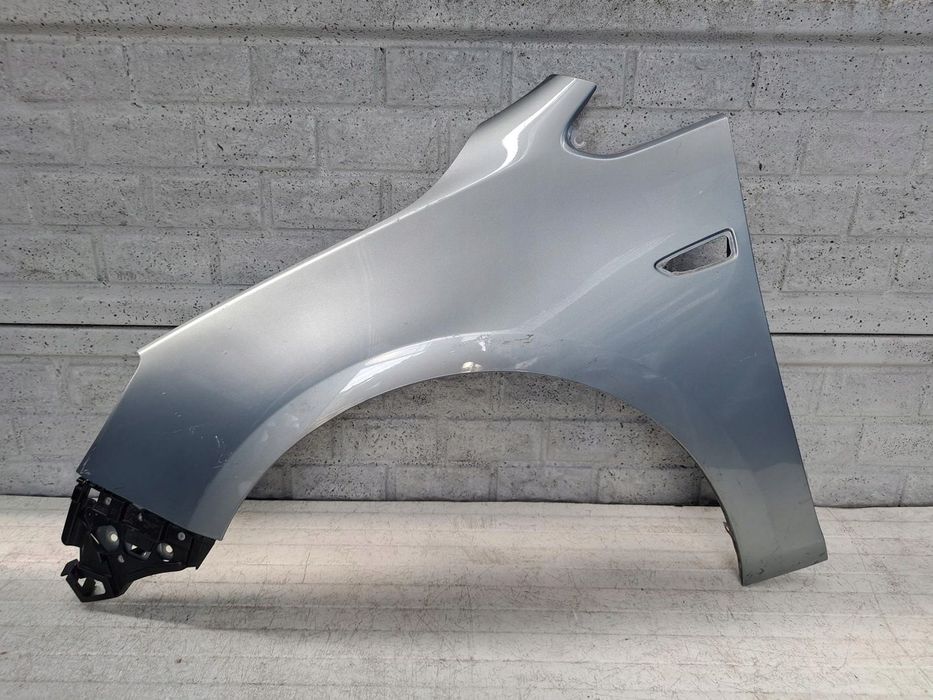 OPEL ASTRA 4 IV J GTC CASCADA 2009-2016 BŁOTNIK PRZEDNI LEWY ORYGINAŁ