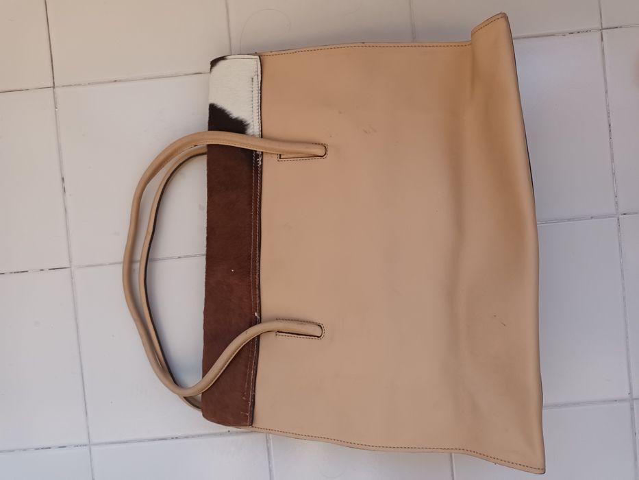 Mala em pele de vaca