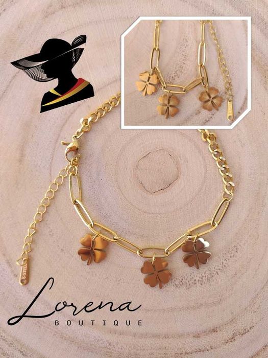 Pulseira em aço dourado com trevos