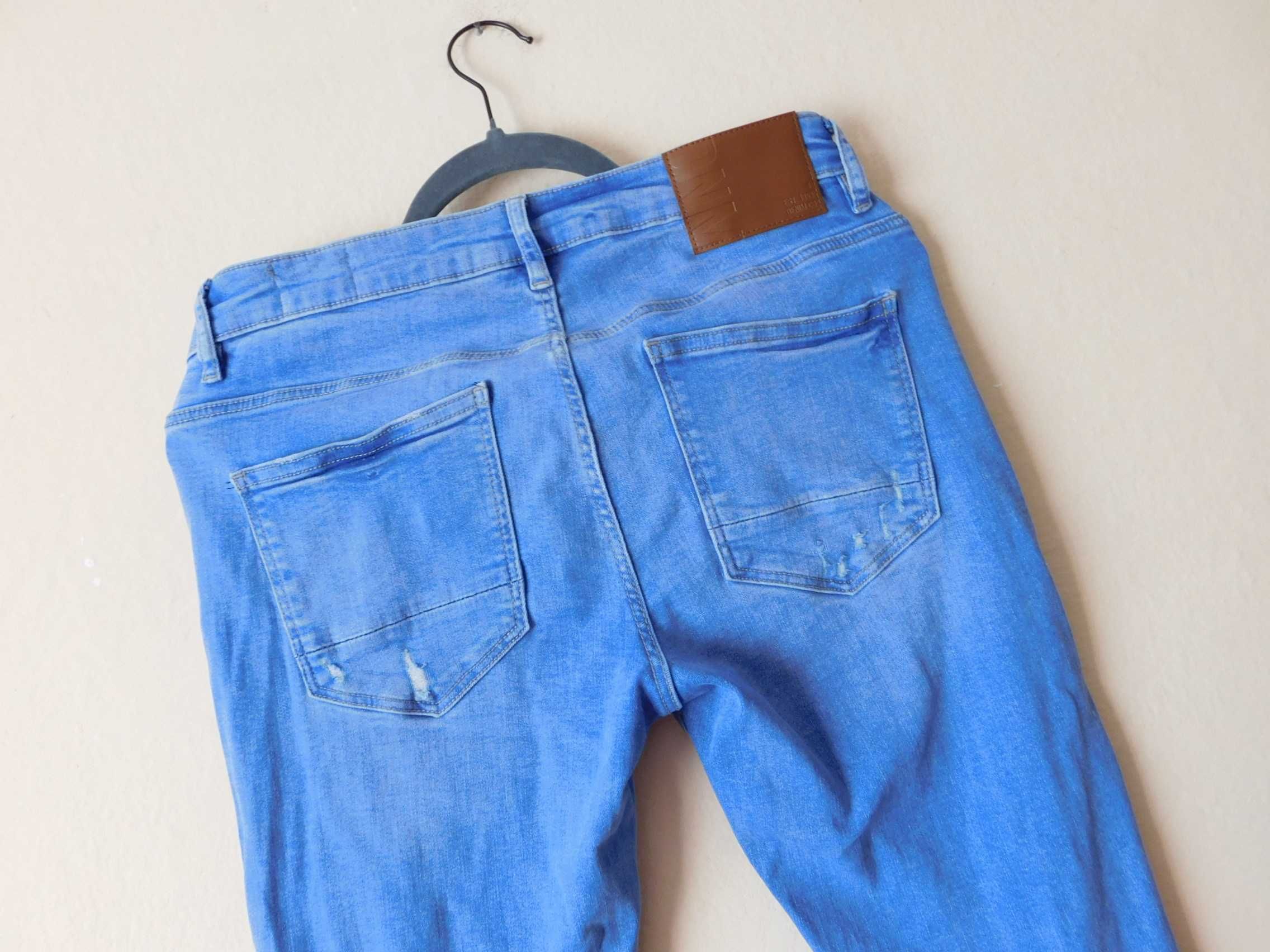 Denim & Co spodnie jeans niebieskie dziury 40 42