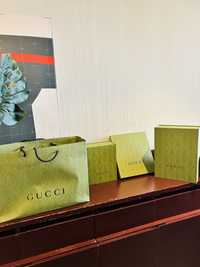 3 caixas Gucci e 1 saco